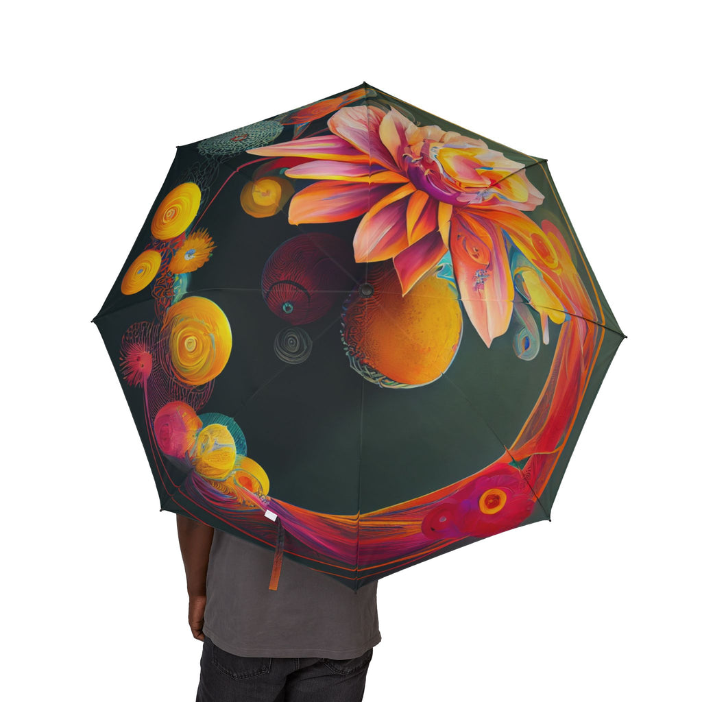 Colorful umbrella with artistic design held by a person on a white background