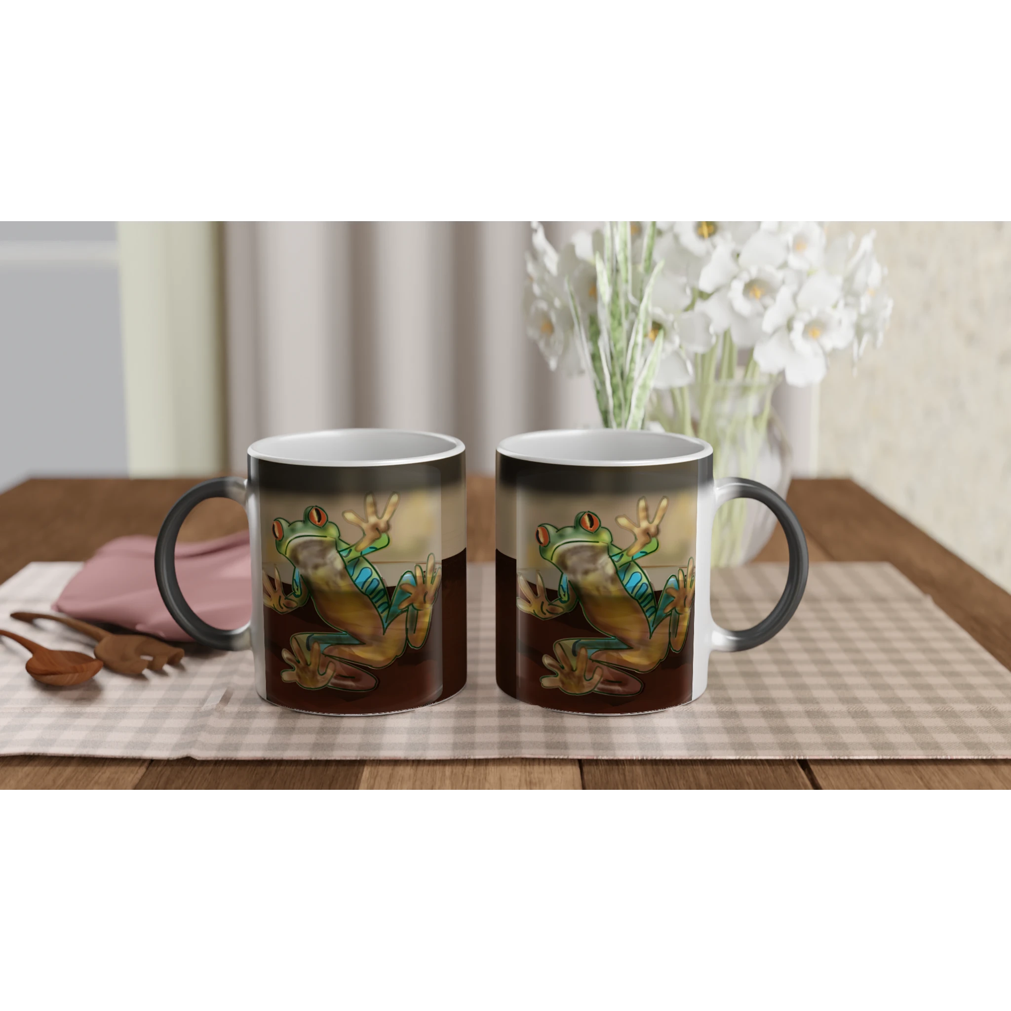Magic color changing 11 oz mug - Toad-ally caffeinated features green and blue tree frog with orange eyes clinging to the side 11oz left and right view on serving tray with flowers