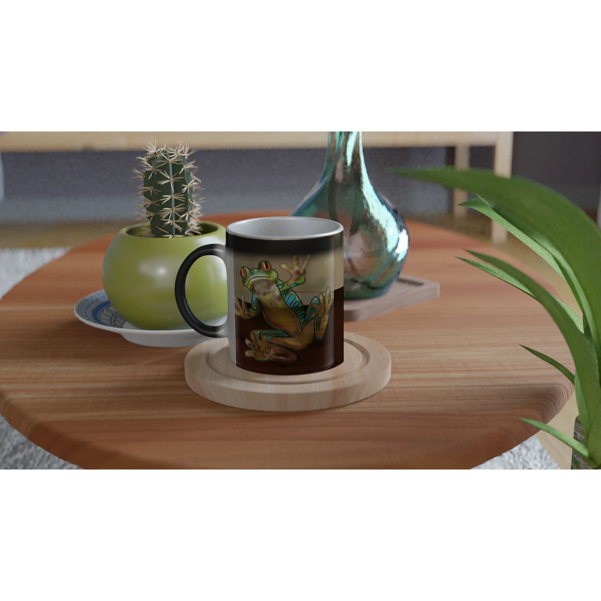 Magic color changing 11 oz mug - Toad-ally caffeinated features green and blue tree frog with orange eyes clinging to the side 11oz right view on table with plant and vase