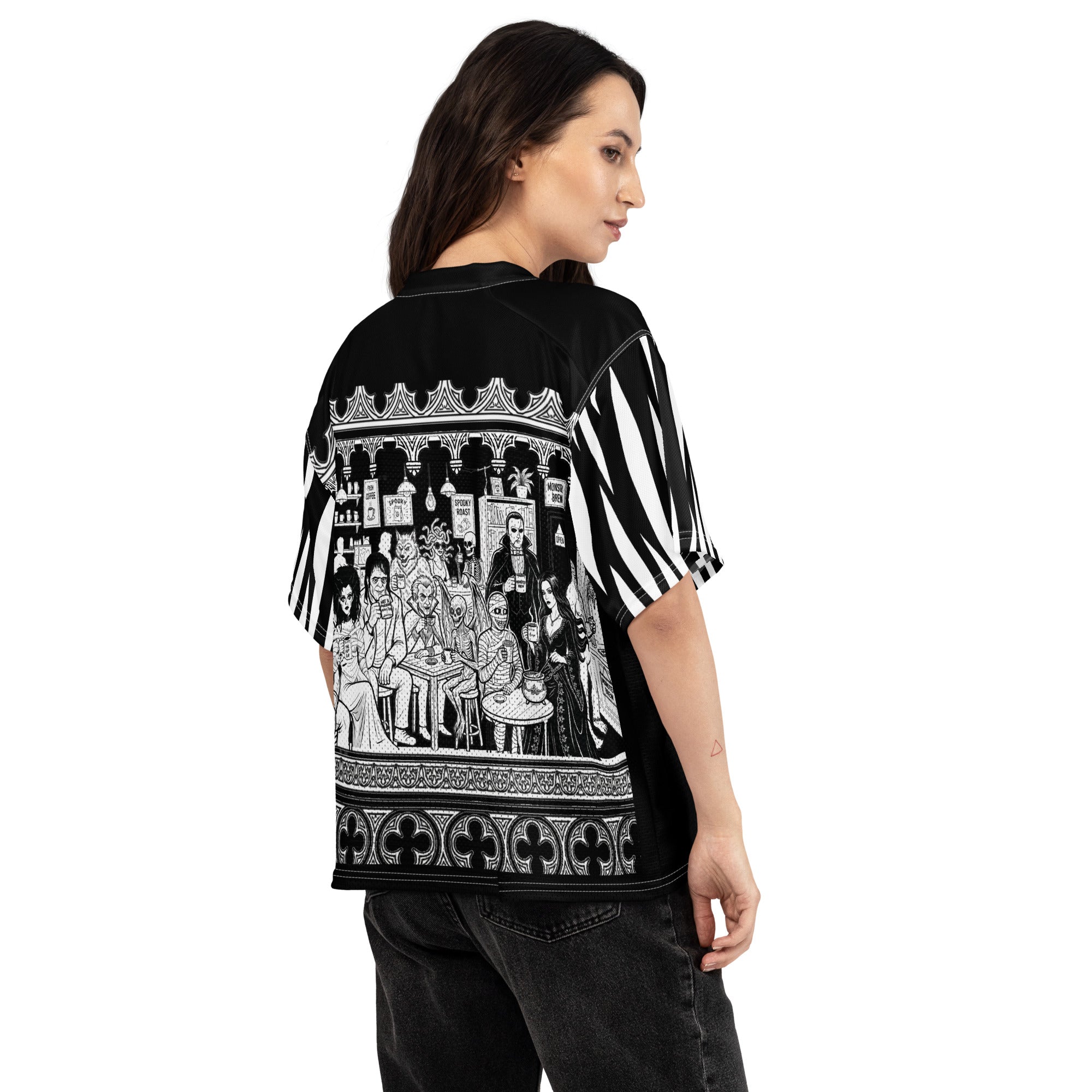 At The Monster Café Brew Crew Jersey — side view showing all 13 monsters gathered at the Monster Brew café, full gothic line art scene framed by ornamental border, black and white all-over print