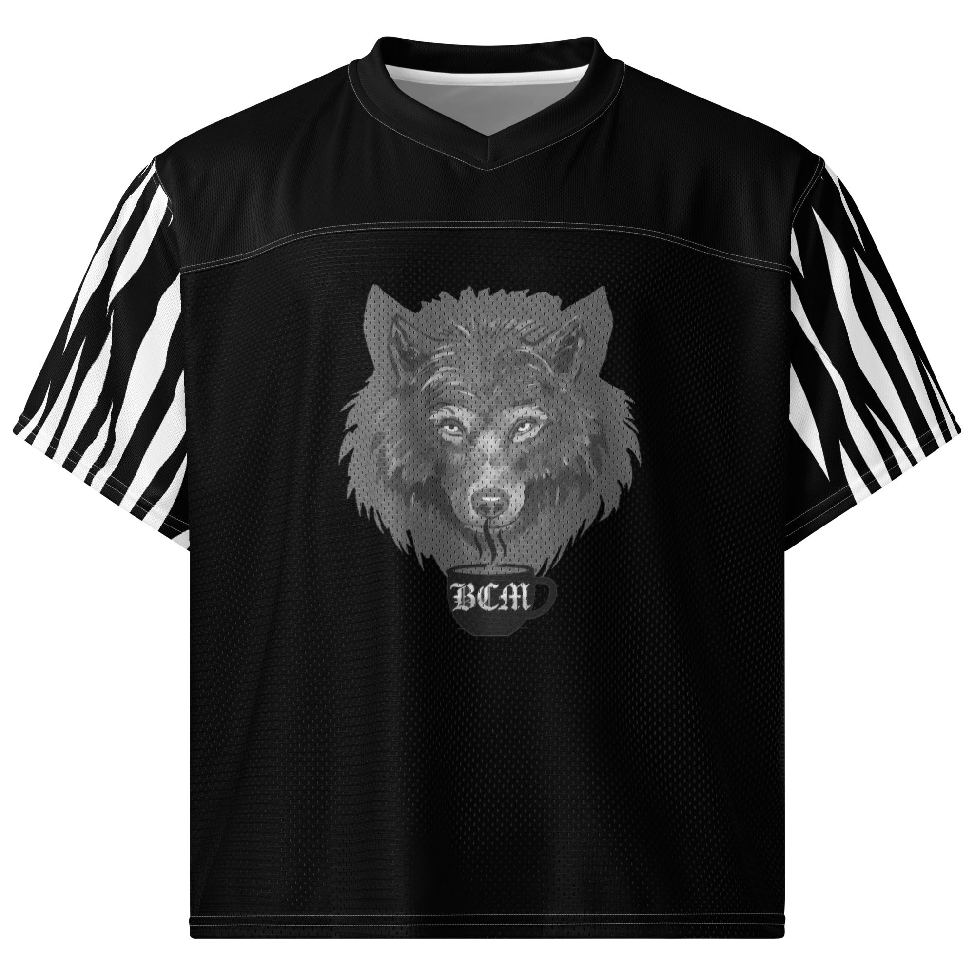 At The Monster Café Brew Crew Jersey — front view on model, black boxy football jersey with wolf head and BCM mug graphic centered on chest, zebra stripe sleeves