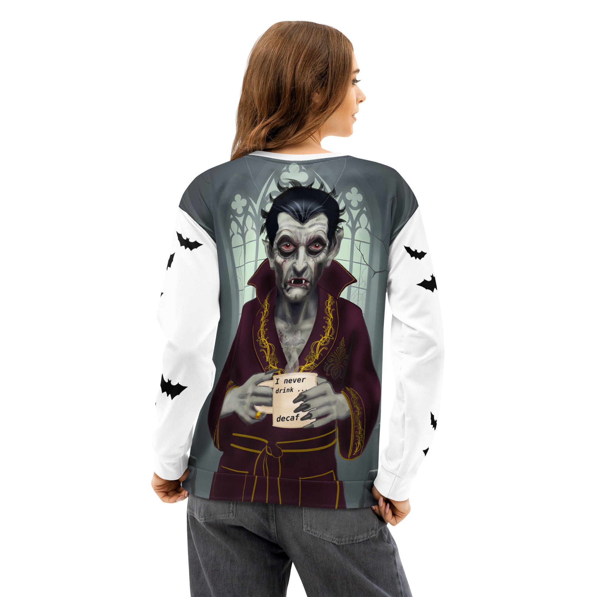 woman wearing I Never Drink Decaf Sweatshirt - Dracula Coffee Gothic | Brew Crew White unisex cotton sweatshirt  Dracula in his castle wearing burgundy bathrobe with gold trim holding his " I never drink ... decaf" coffee mug. Sleeves covered with bats. Back view.