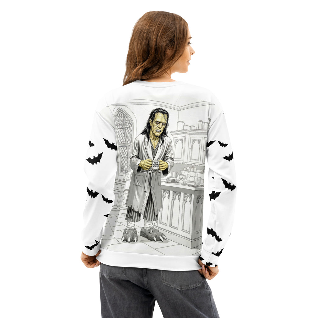 All over print unisex cotton sweatshirt - Brew-kenstein holding coffee mug with "not a morning monster" print - kitchen view - monster wearing bathrobe and monster slippers - bats on sleeves -2XS-6XL - back view 