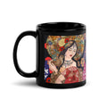 Premium Ceramic black glossy mug with Klimt inspired artwork of a stunning nature goddess adorned with an ornate golden floral headdress, red poppies in her hair, and intricate jewelry. She holds a delicate bird in her hand, surrounded by a vibrant kaleidoscope of flowers and an ornamental parasol - 11 oz - left view