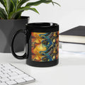 Black ceramic mug with colorful abstract nature design on desk by plant and books
