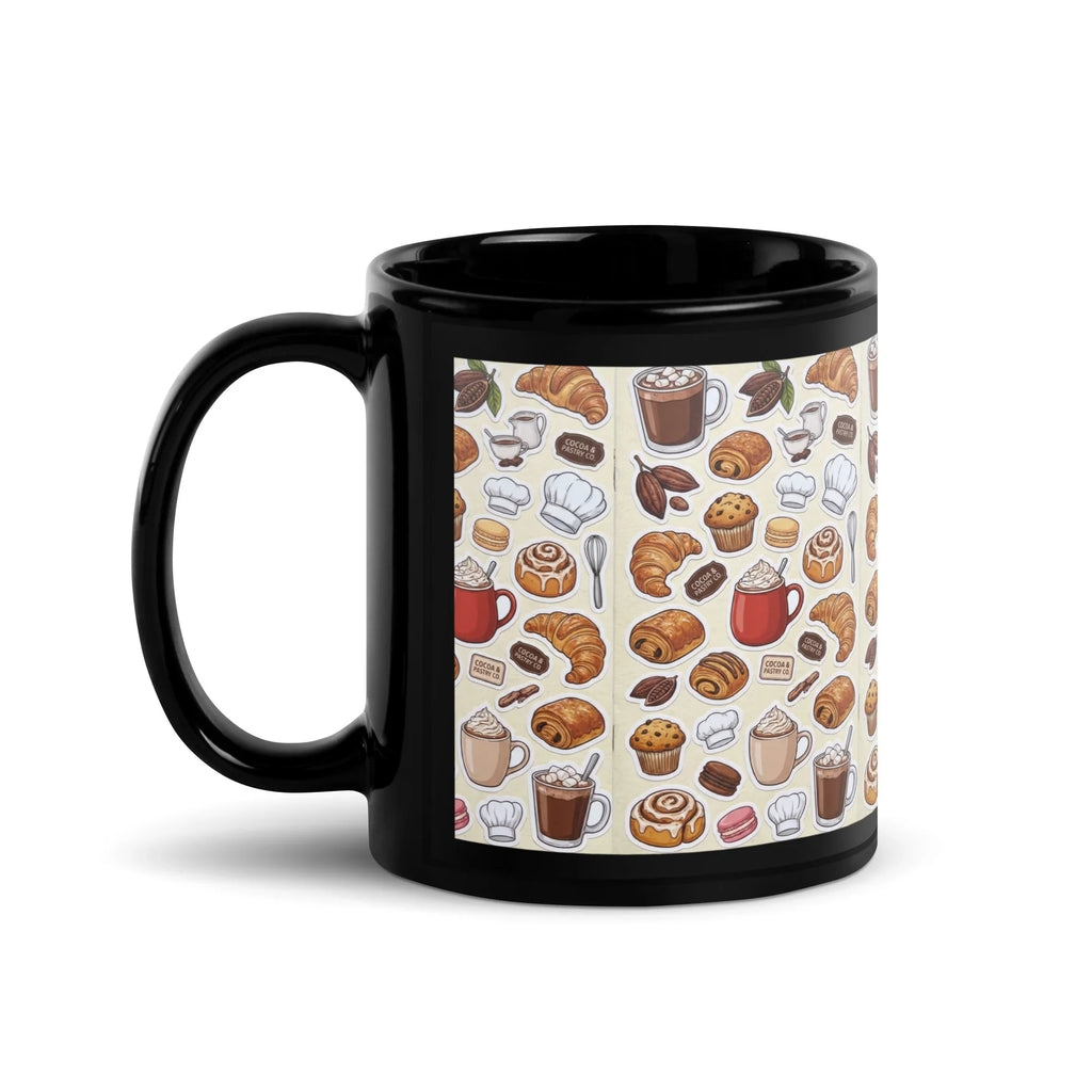 Black ceramic mug with handle on left, featuring colorful pastry and coffee pattern.