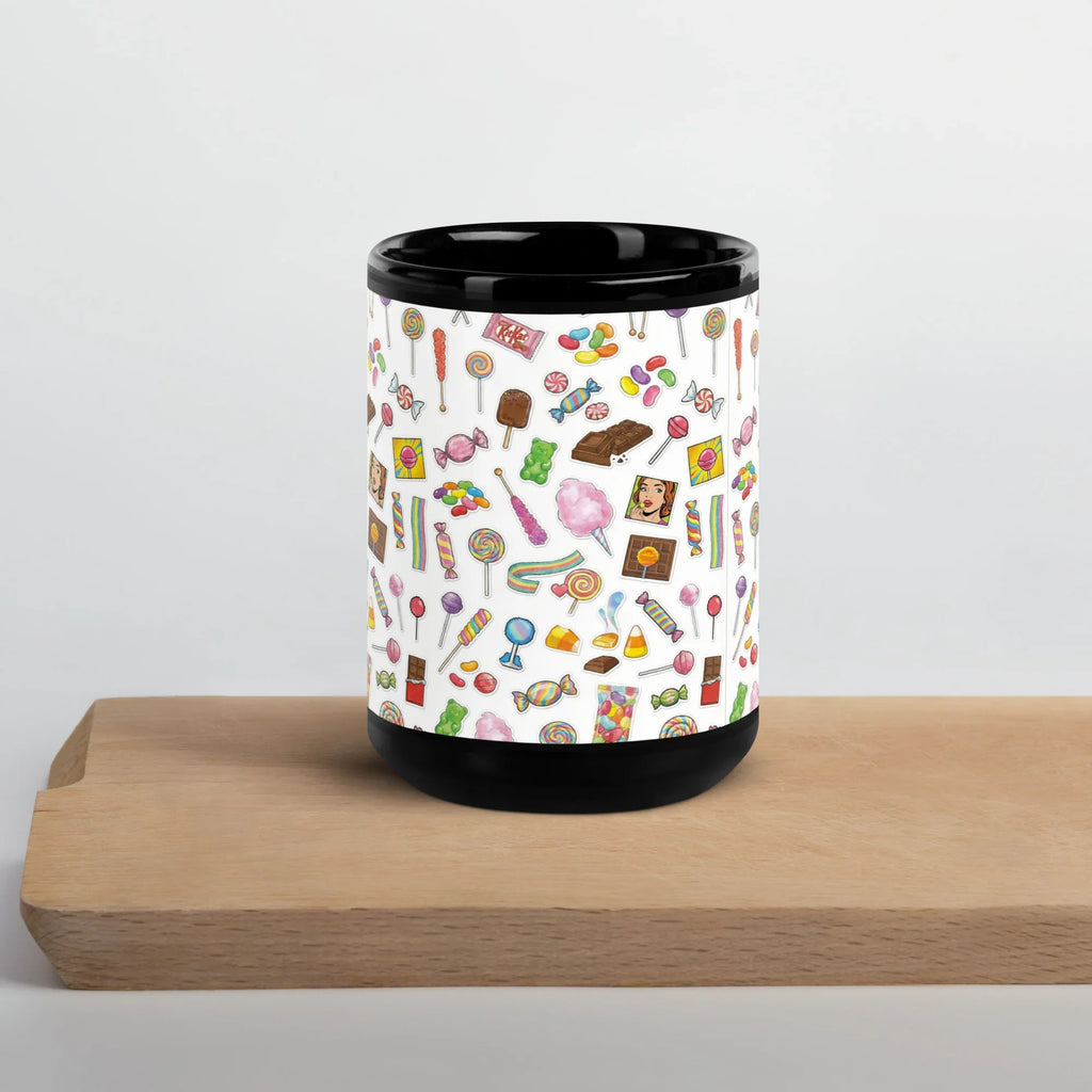Black glossy ceramic mug with colorful candy motif, 15 oz, on wooden board