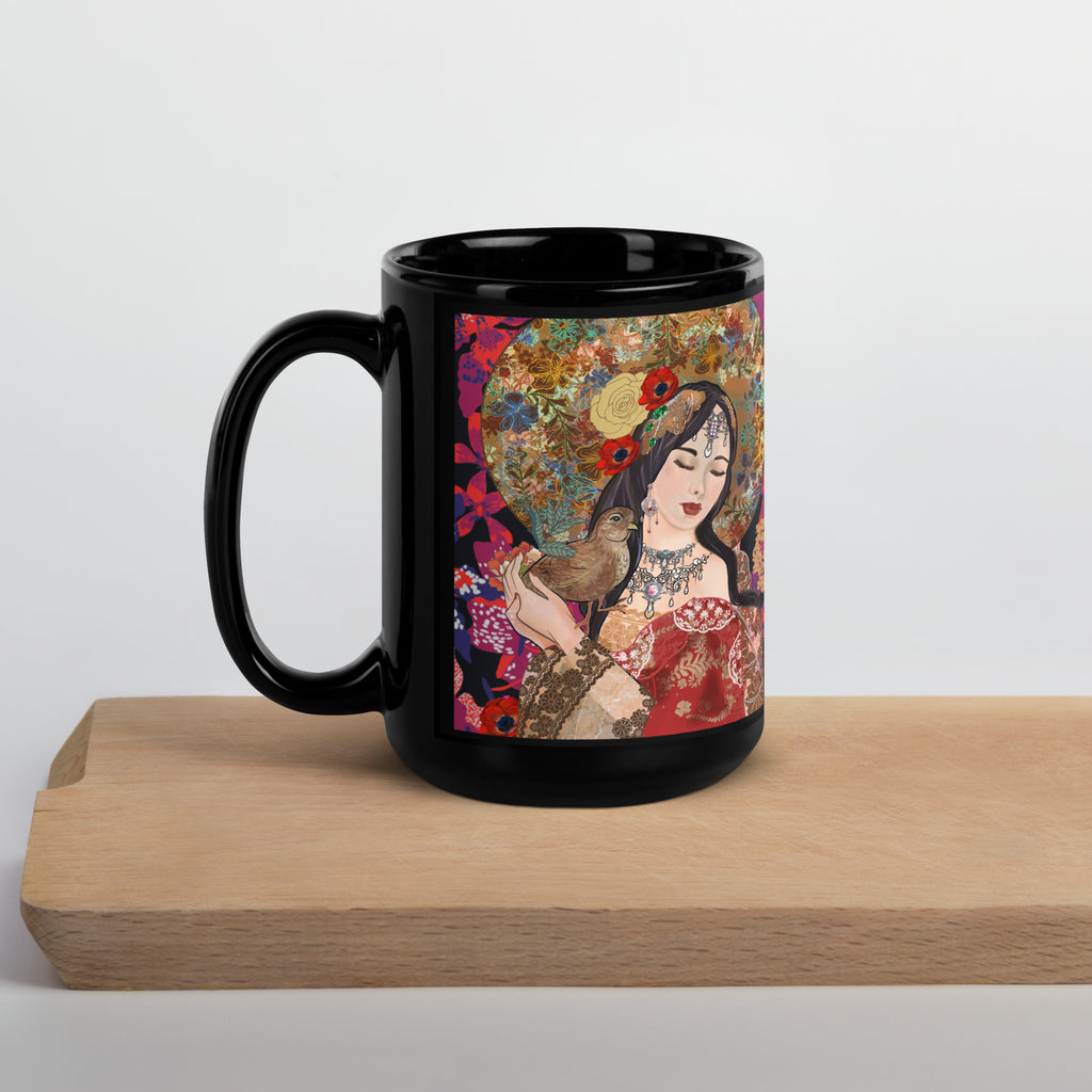 Premium Ceramic black glossy mug with Klimt inspired artwork of a stunning nature goddess adorned with an ornate golden floral headdress, red poppies in her hair, and intricate jewelry. She holds a delicate bird in her hand, surrounded by a vibrant kaleidoscope of flowers and an ornamental parasol - 15 oz - left view