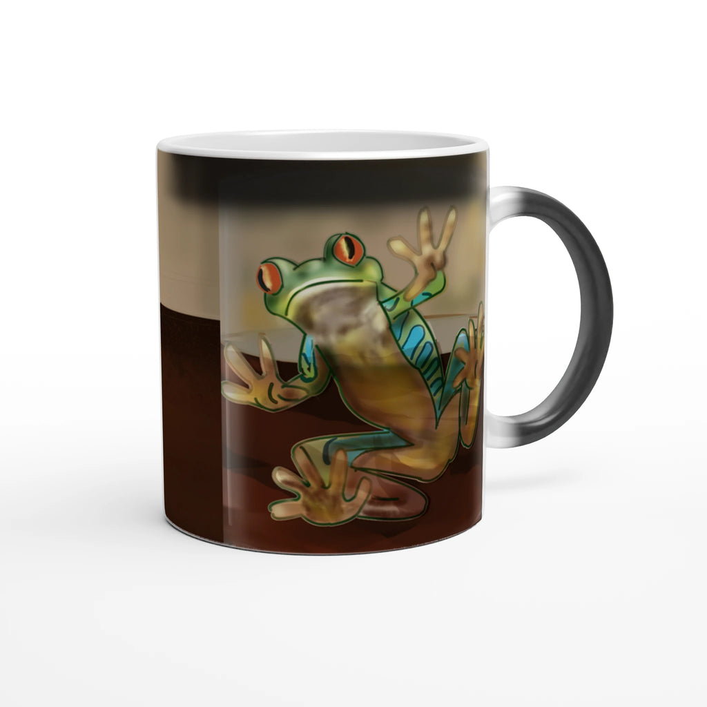 Magic color changing 11 oz mug - Toad-ally caffeinated features green and blue tree frog with orange eyes clinging to the side 11oz right view on white background
