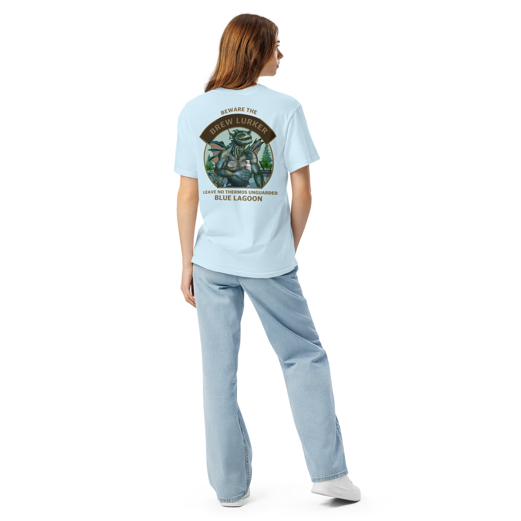 Girl wearing a light blue t-shirt with a Brew Lurker design on the back, standing against a white background.