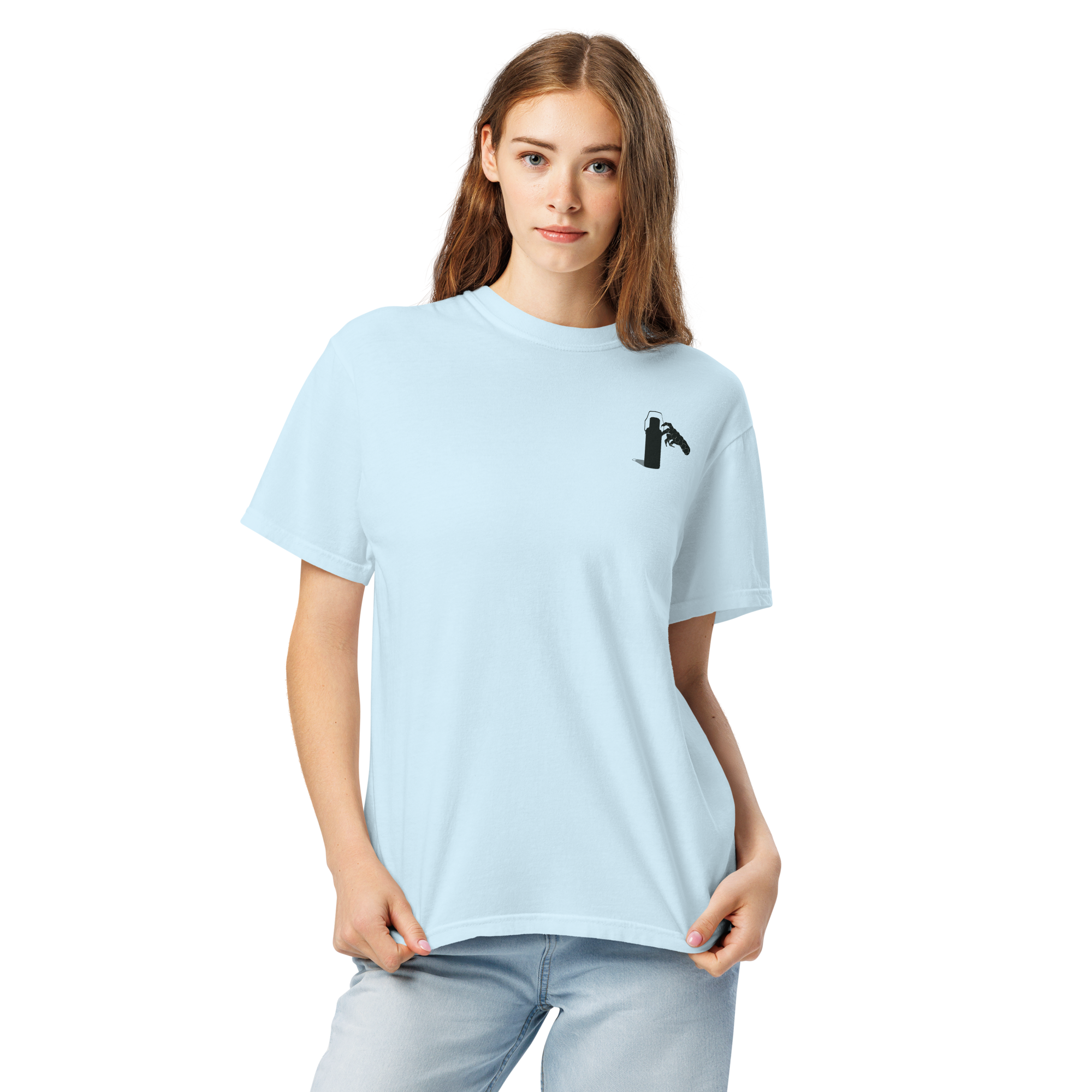 Woman wearing a light blue t-shirt with a graphic of claw and coffee thermos