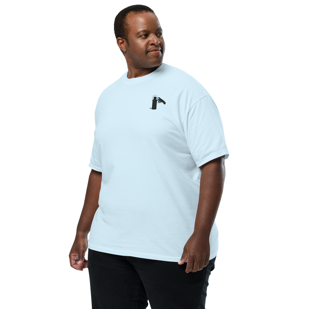 Man wearing a white t-shirt with a small graphic of claw and coffee thermos