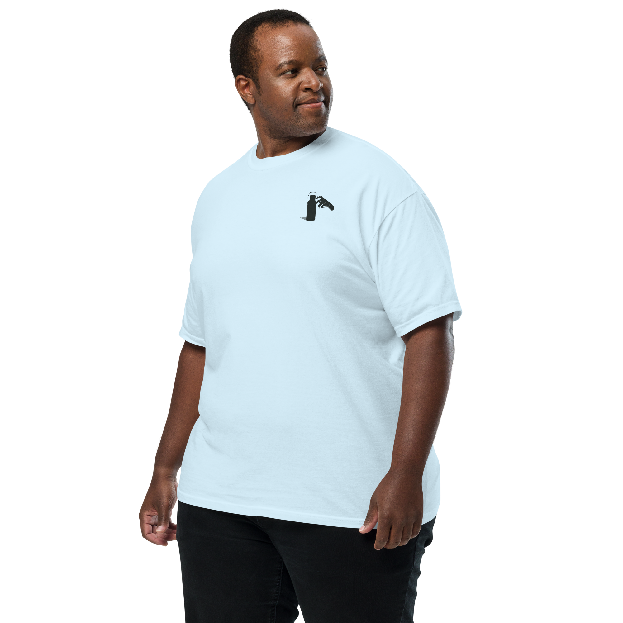 Man wearing a white t-shirt with a small graphic of claw and coffee thermos