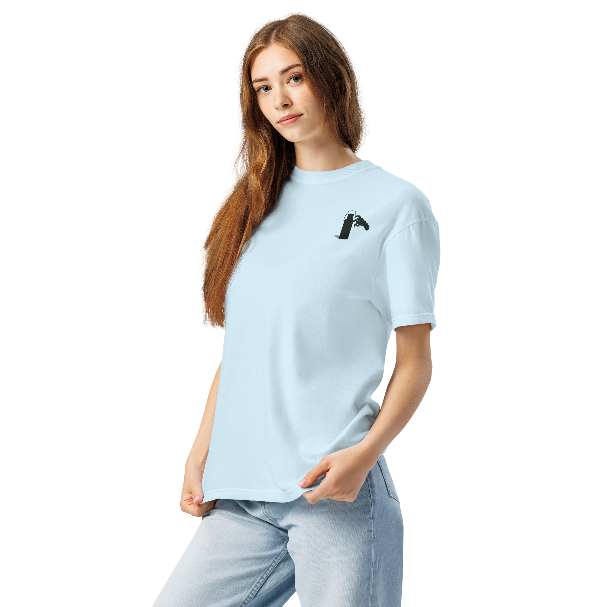 Woman wearing a light blue t-shirt with a small graphic of claw and coffee thermos