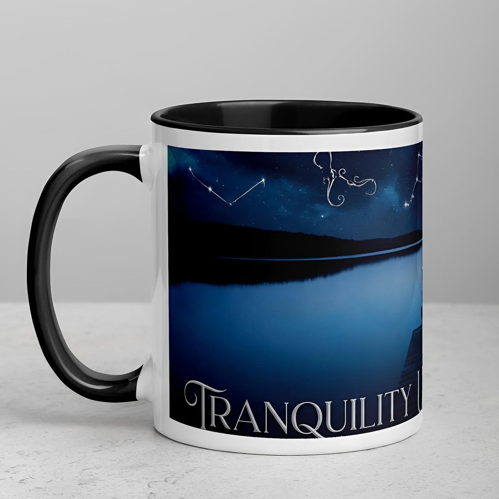 White ceramic mug with black handle and interior, night sky lake scene and 'Tranquility' text