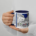 Fun Premium White Ceramic mug with navy blue color inside features a  night under the stars where people gather at an outdoor café and enjoy their coffee in colorful mugs.  11 - oz left view