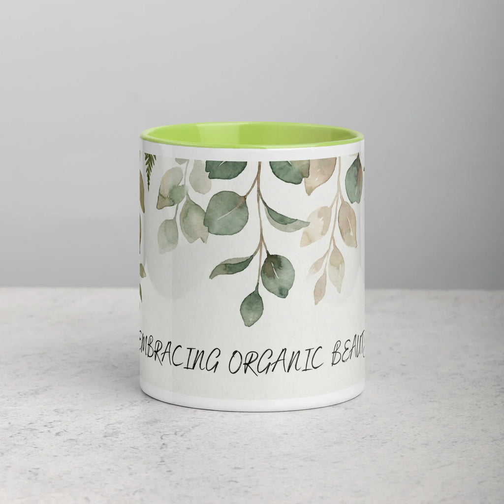 Mug with leaf pattern and text 'Embracing Organic Beauty' on a gray background - 11oz front view