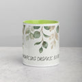 Mug with leaf pattern and text 'Embracing Organic Beauty' on a gray background - 11oz front view