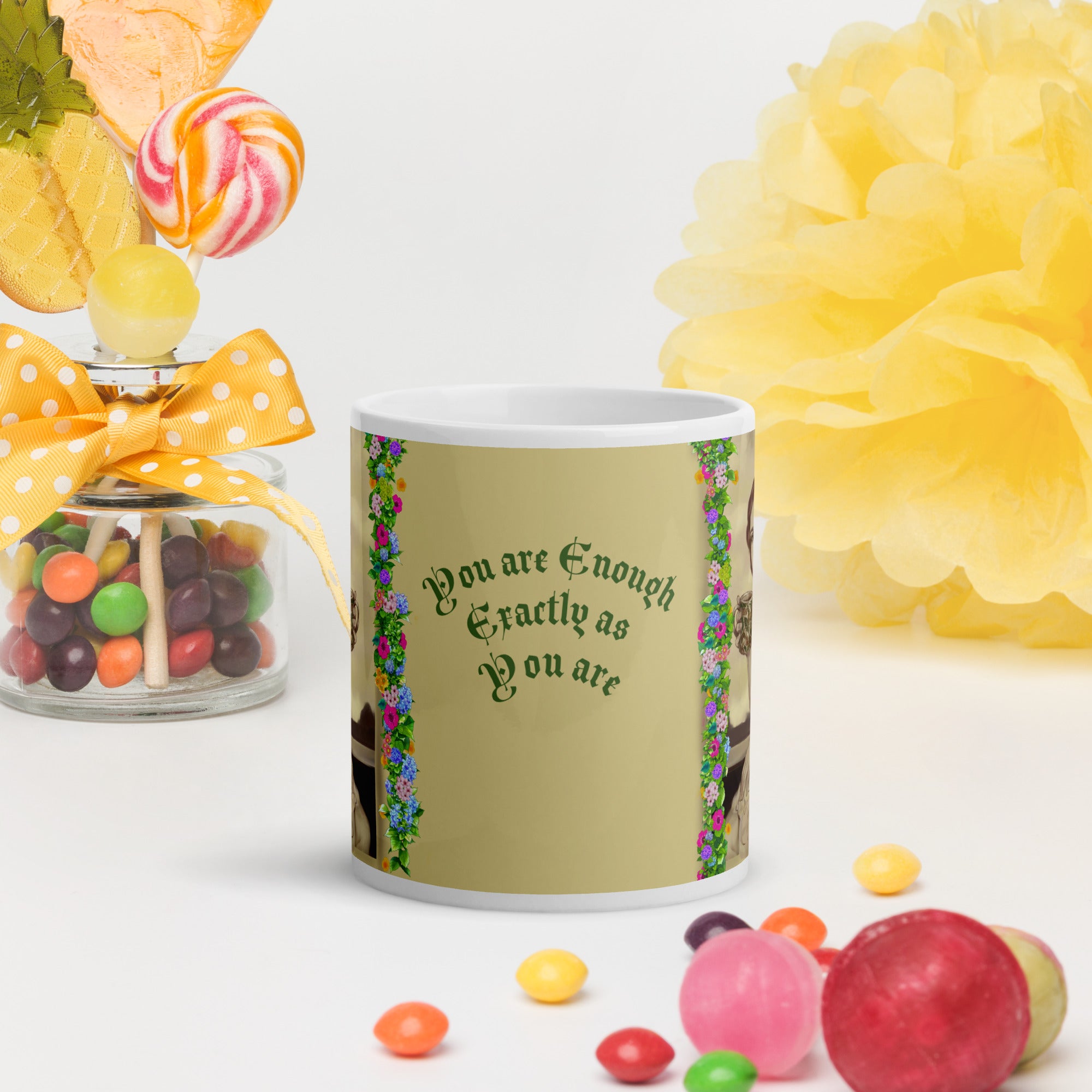 Beautiful Premium white ceramic mug features a vintage sepia-toned woman with flowing hair, holding an ornate decorative mug, framed by colorful floral garlands. With the empowering message "You are Enough Exactly as You are" -11 - oz front view