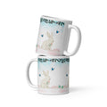 Premium White Ceramic - Bunny and Butterfly Mug -Gentle cream-colored bunny in peaceful garden setting
Blue butterflies fluttering around the scene
Eucalyptus and floral garland border at top
Soft pink cherry blossom accents and pastel Easter eggs at bottom
Soft turquoise sky background with watercolor effect - 11 oz 