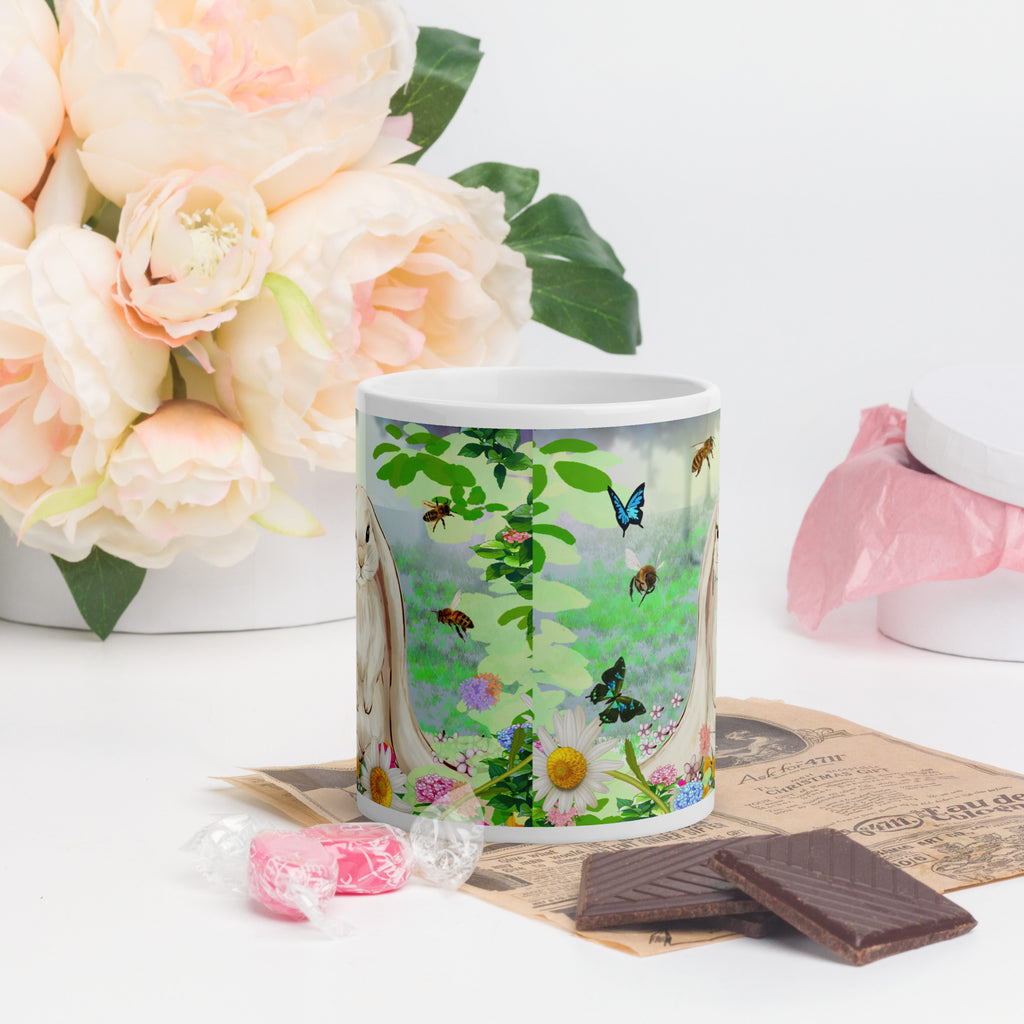 Premium white ceramic- Floppy Eared Easter Bunny Mug- Forest setting adorable floppy eared bunny surrounded by flowers ,butterflies and a few bees. 11 oz - front view