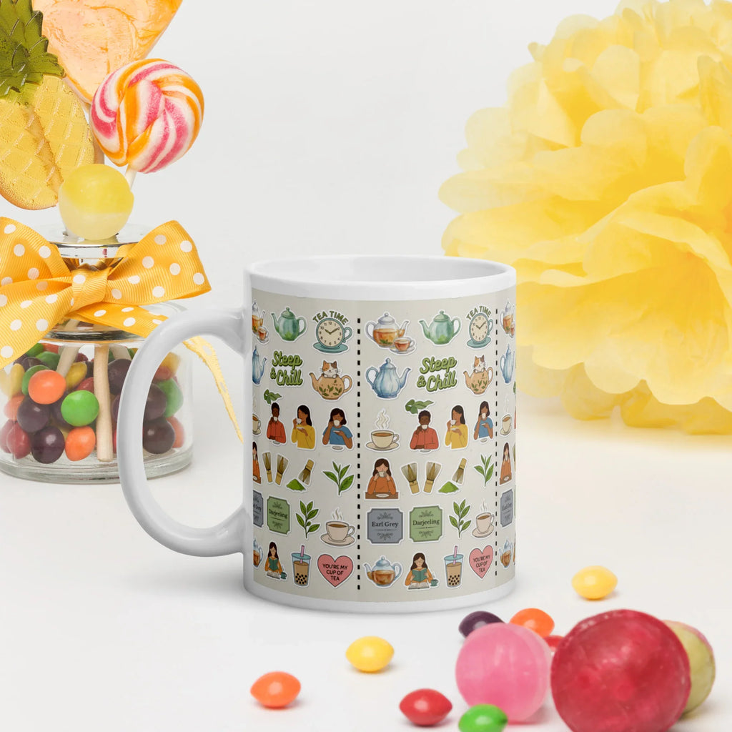 Ceramic mug with colorful tea and nature motifs, surrounded by candy and bright decor
