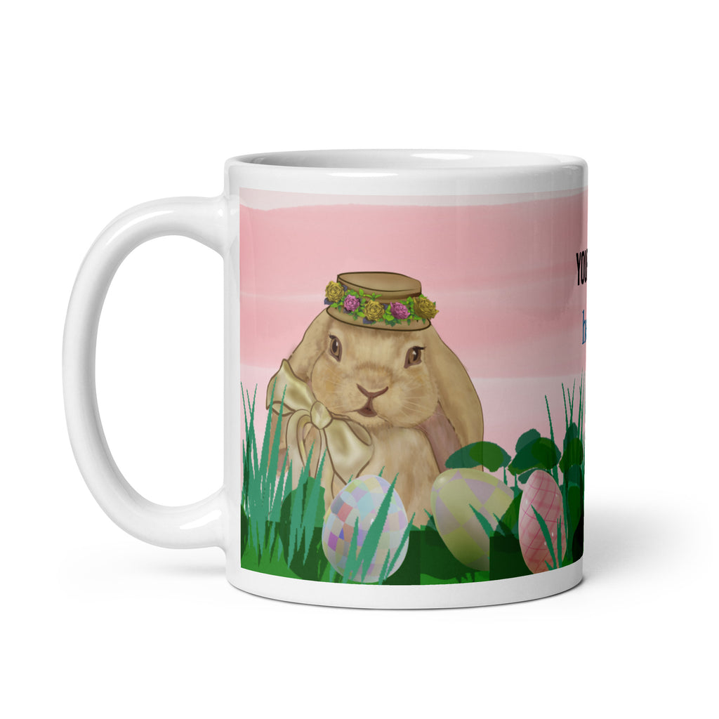 Spring Bunny Lady Mug Easter Coffee Mug with charming spring bunny adorned with a delicate flower crown hat in field of grass, pink sky and Easter eggs. Customize with text in all sizes - 11 oz - left view