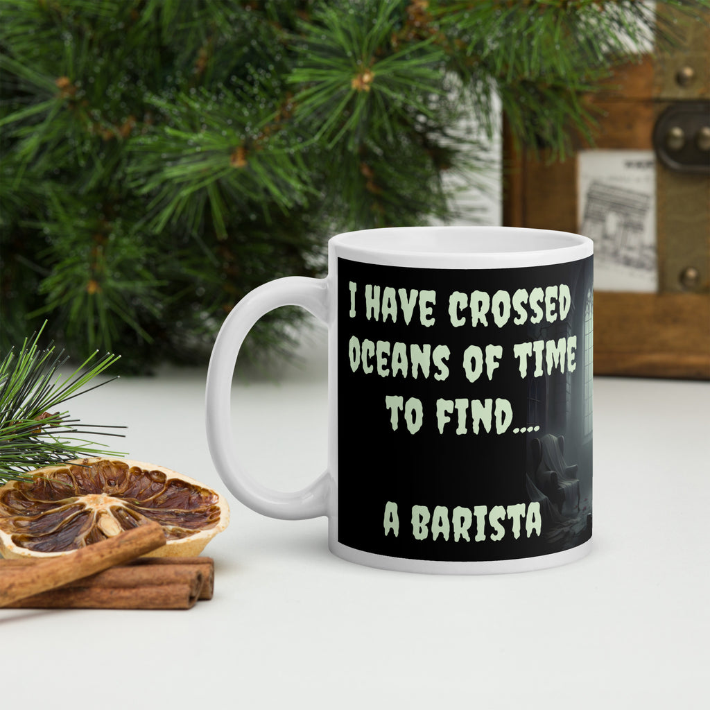 Dracula Coffee Mug - I Have Crossed Oceans of Time to Find a Barista- Premium white ceramic mug with text "I HAVE CROSSED OCEANS OF TIME TO FIND... A BARISTA" - Black background - creepster font in pale green shade.  mug on cutting board 11 oz left view