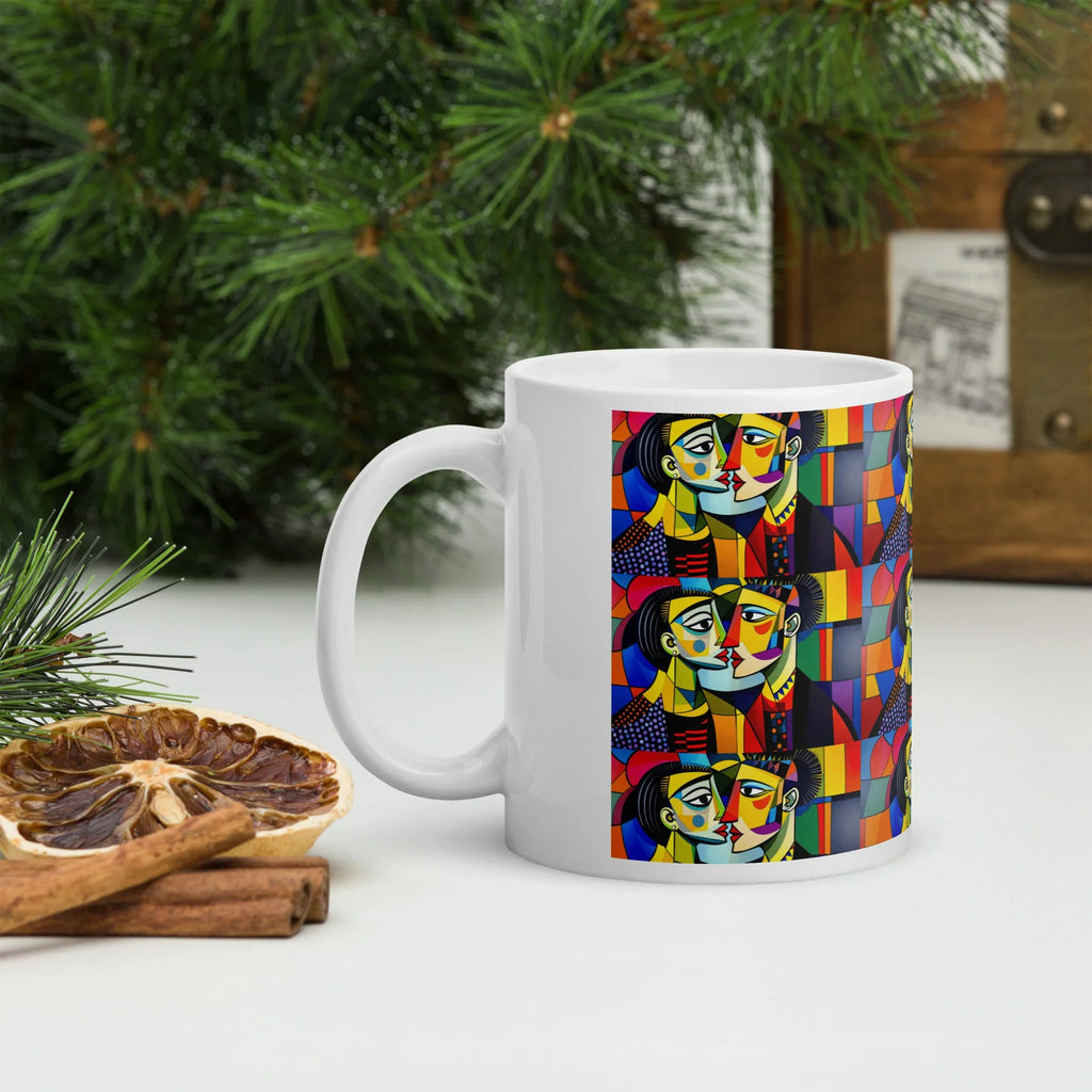 White ceramic mug with colorful abstract faces, nature background, cinnamon sticks nearby