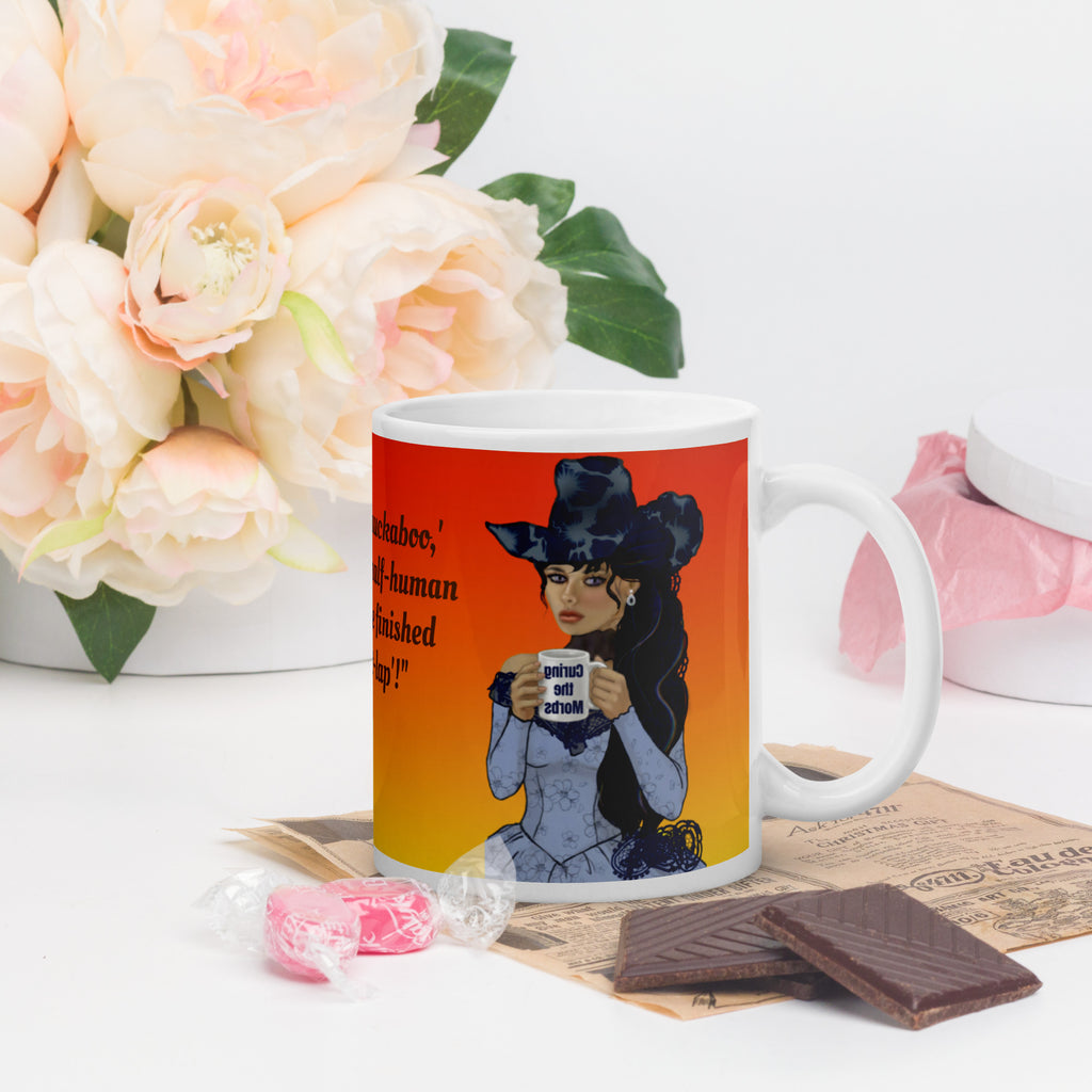 Stunning Premium white ceramic mug features a gorgeous gothic Victorian lady with incredible dark blue floral hat and long flowing hair, pale porcelain skin, and striking features. Dressed in an elegant blue corset-style dress, she holds a mug that says "Curing the Morbs."  11 - oz right view