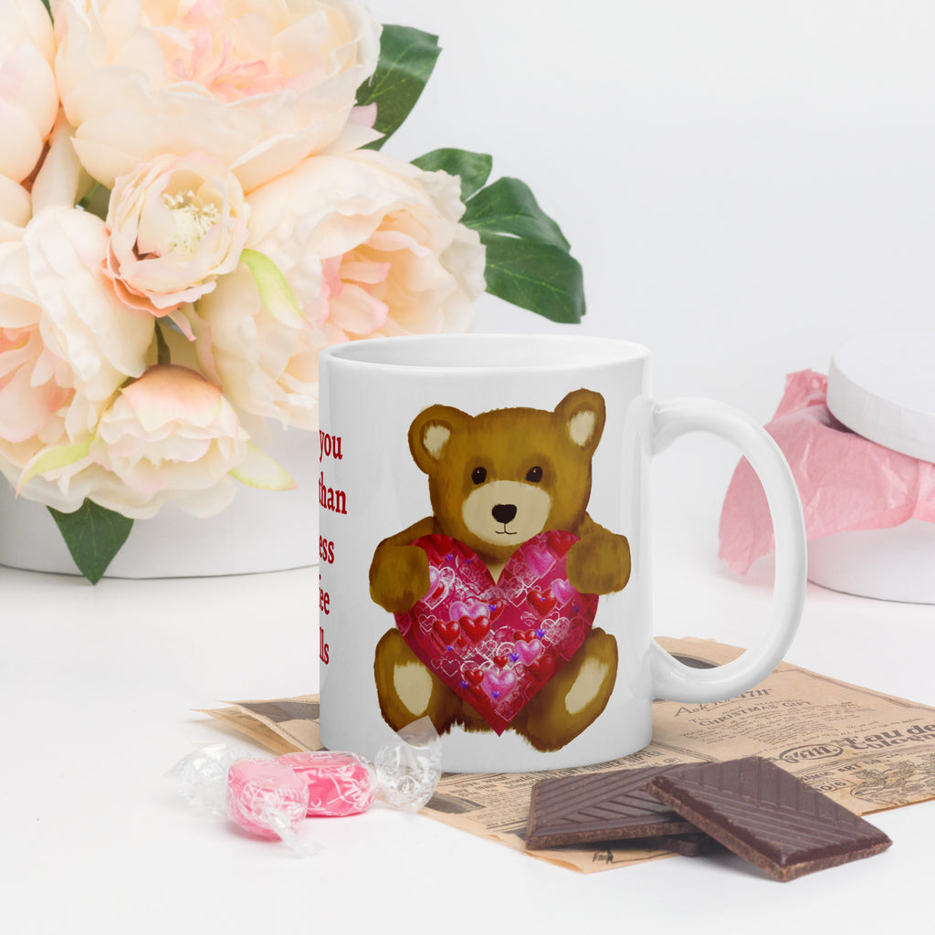 Premium White Ceramic mug - on a table with flowers and chocolates- Personalized text=  Valentines Day Bear with geometric Pink and red heart coffee mug. 11 oz - right view