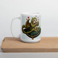 Sleepy Sloth Dragon mug on wooden cutting board — awake dragon holding coffee cup with hearts, gothic fantasy ceramic mug- single mug, cutting board - 15 oz left view