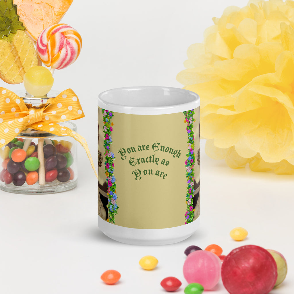 Beautiful Premium white ceramic mug features a vintage sepia-toned woman with flowing hair, holding an ornate decorative mug, framed by colorful floral garlands. With the empowering message "You are Enough Exactly as You are" -15 - oz front view