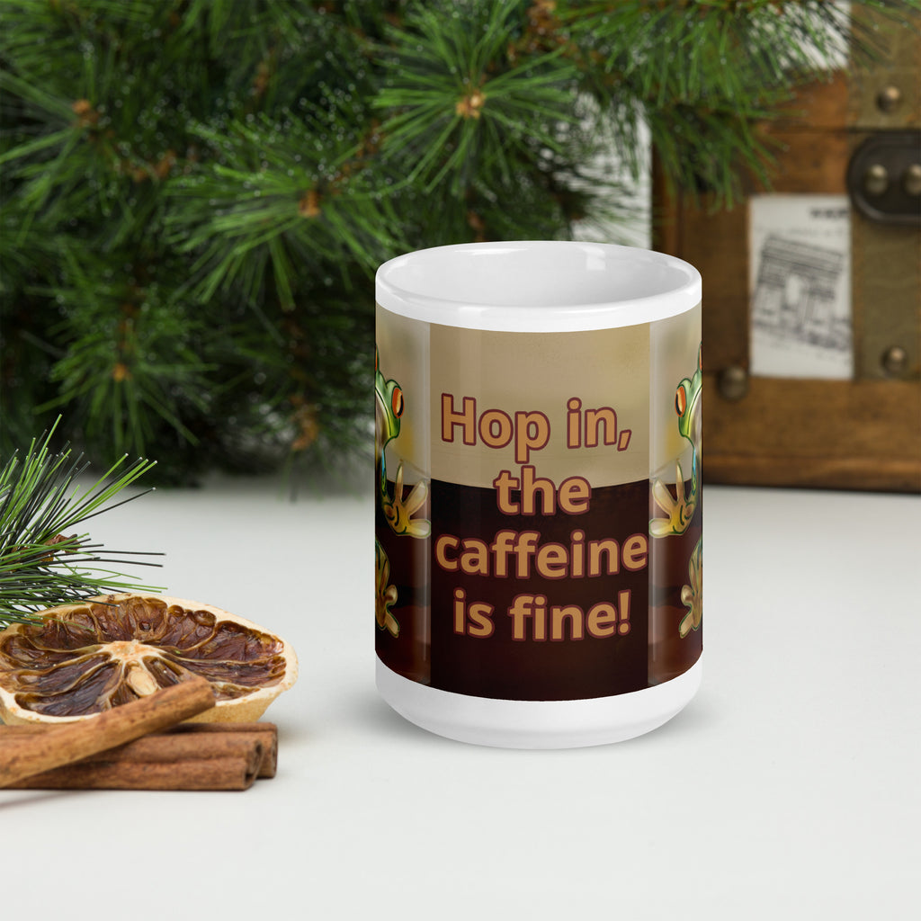 Premium white ceramic - Hop in, the caffeine is fine! text on coffee mug- features a bright green and blue tree frog peeking through the coffee with bright orange eyes - 15 oz front view