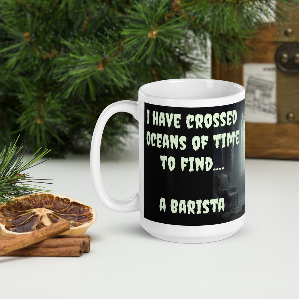 Dracula Coffee Mug - I Have Crossed Oceans of Time to Find a Barista- Premium white ceramic mug with text "I HAVE CROSSED OCEANS OF TIME TO FIND... A BARISTA" - Black background - creepster font in pale green shade.  mug on table with plants 15 oz left view