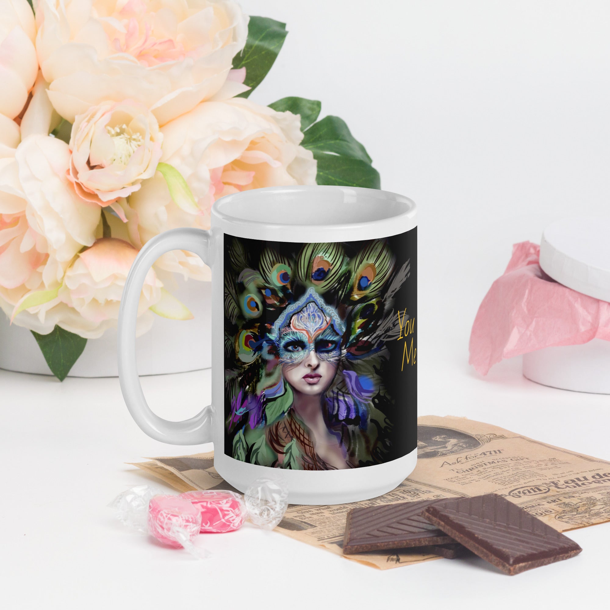 Stunning Premium white ceramic mug features a majestic woman adorned with vibrant peacock feathers, ornate blue and orange face paint, and a regal purple and green costume. With the inspiring message "You Are Majesty, 15- oz left view