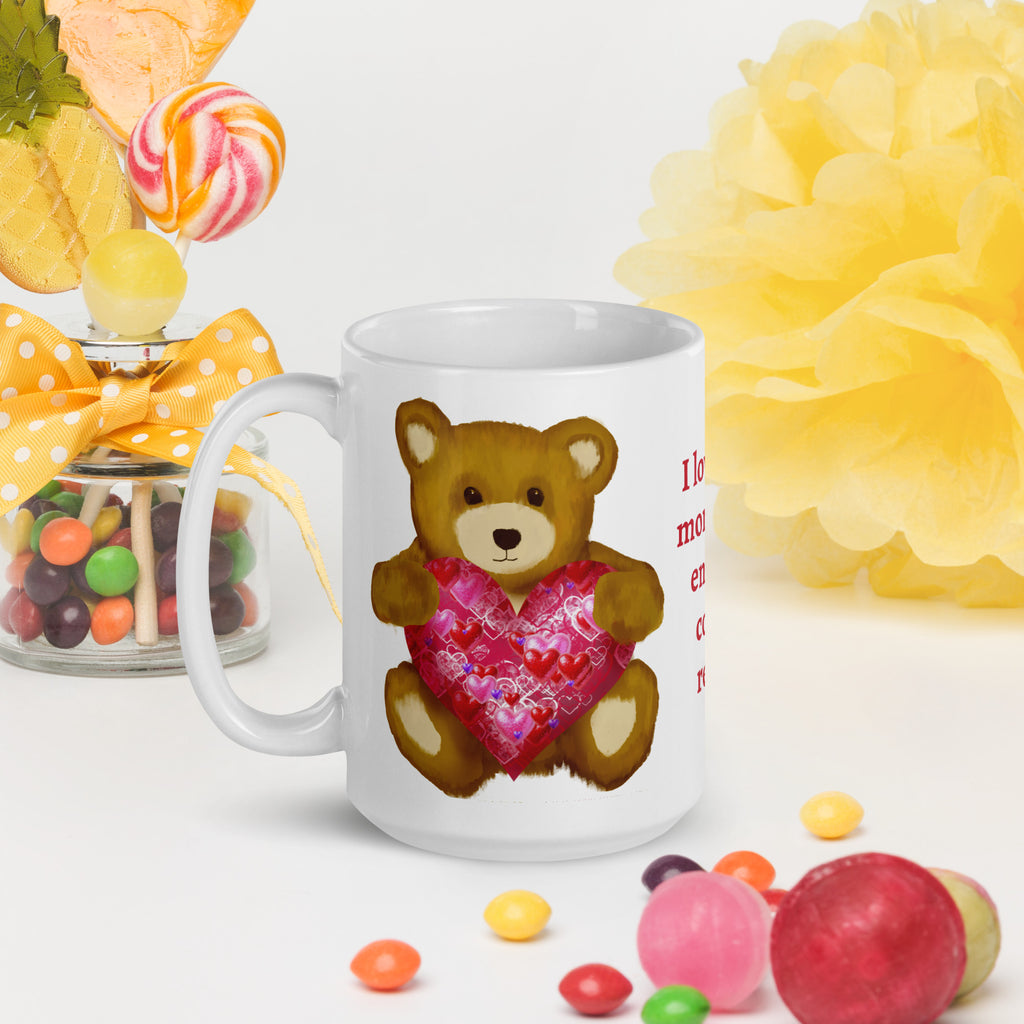Premium White Ceramic mug - held in persons hand on a table with party decorations and colored candy - Valentines Day Bear with geometric Pink and red heart coffee mug. 15 oz - left view
