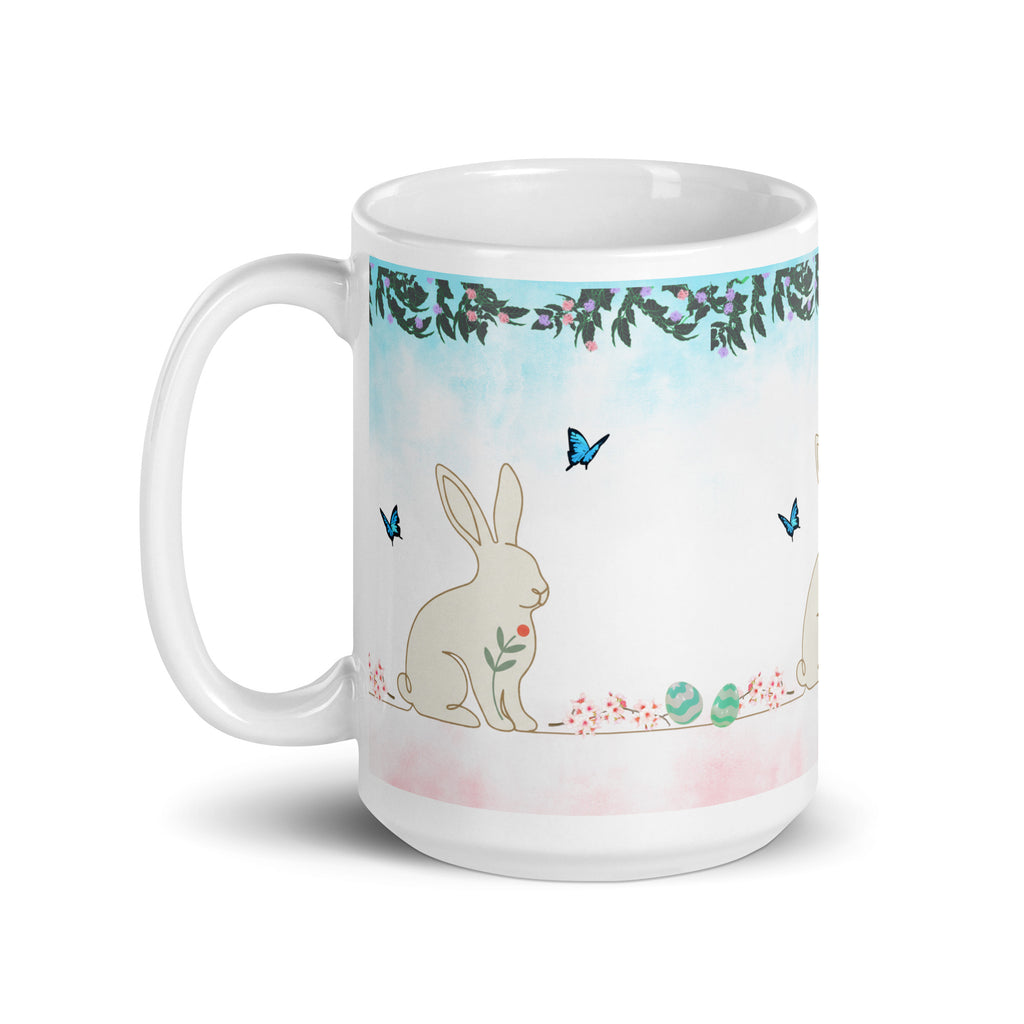 Premium White Ceramic - Bunny and Butterfly Mug -Soft turquoise sky background with watercolor effect Gentle cream-colored bunny in peaceful garden setting-Blue butterflies fluttering around the scene
Eucalyptus and floral garland border  - 15 oz left view