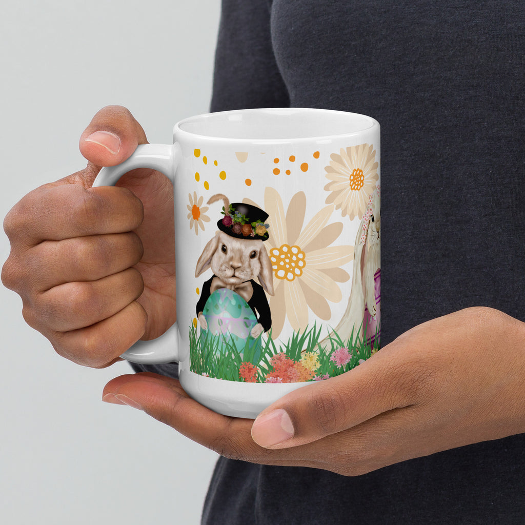  Premium white ceramic mug- Easter Bunny Trio -Features a dapper bunny in a suit holding an green easter egg in a floral garden with abstract yellow floral background - 15 oz left view
