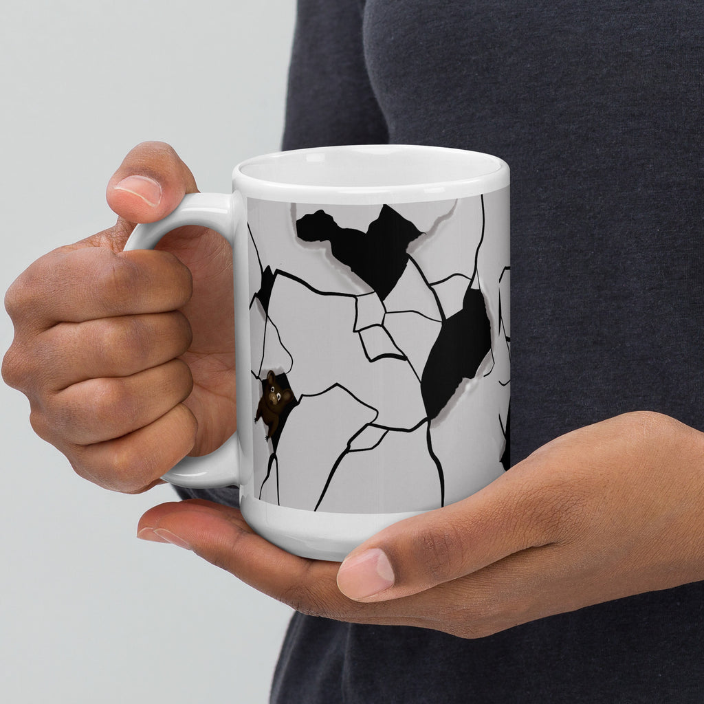 Premium white ceramic - cracked wall design- Mouseterious mug - black and white with mouse peeking through hole in wall - 15 oz left view