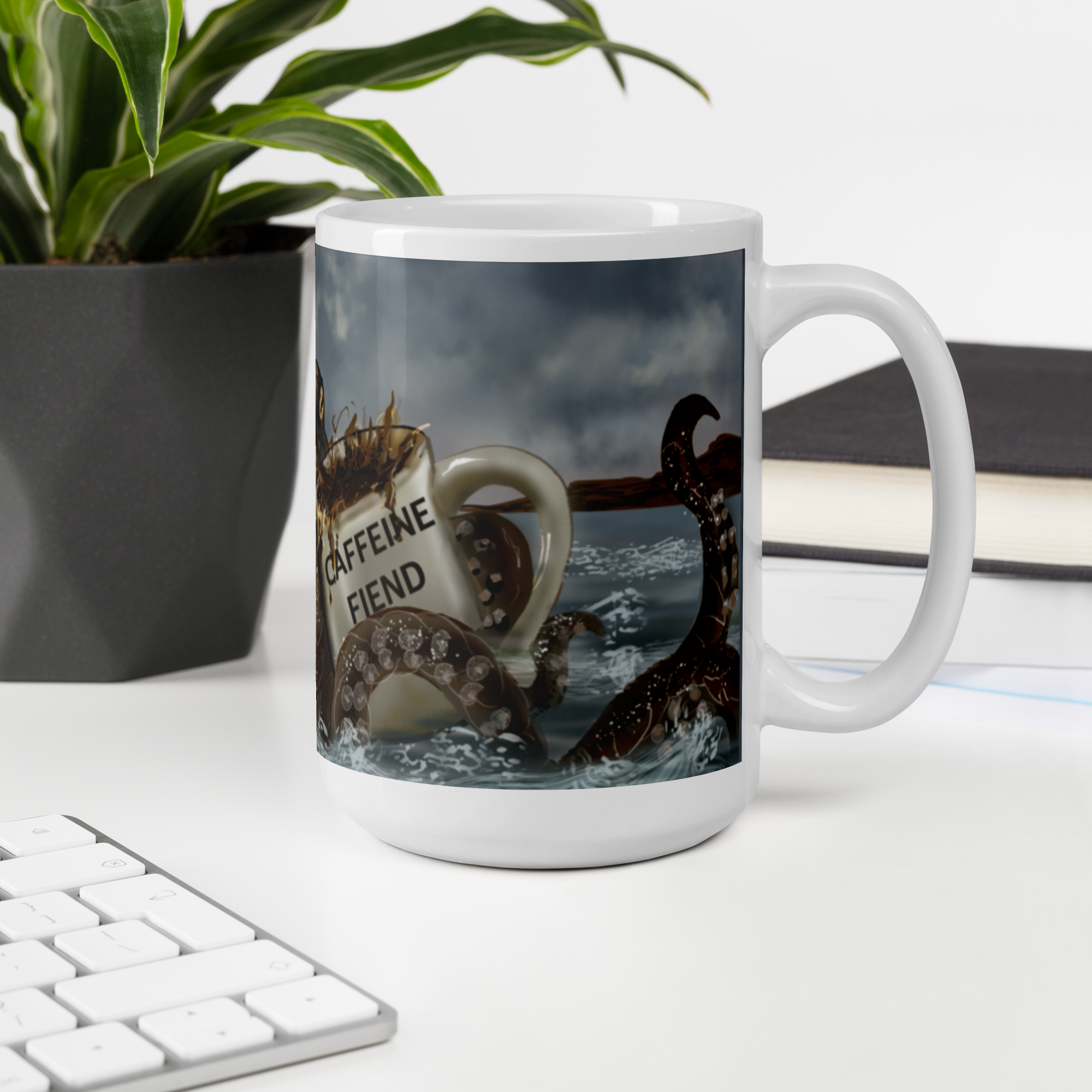 Premium ceramic Mug with a Kraken and coffee design on a desk with a plant and books in the background - 15 oz right view