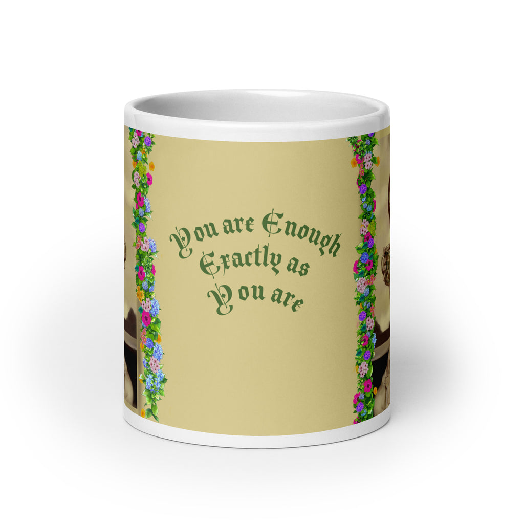 Beautiful Premium white ceramic mug features a vintage sepia-toned woman with flowing hair, holding an ornate decorative mug, framed by colorful floral garlands. With the empowering message "You are Enough Exactly as You are" -20 - oz front view