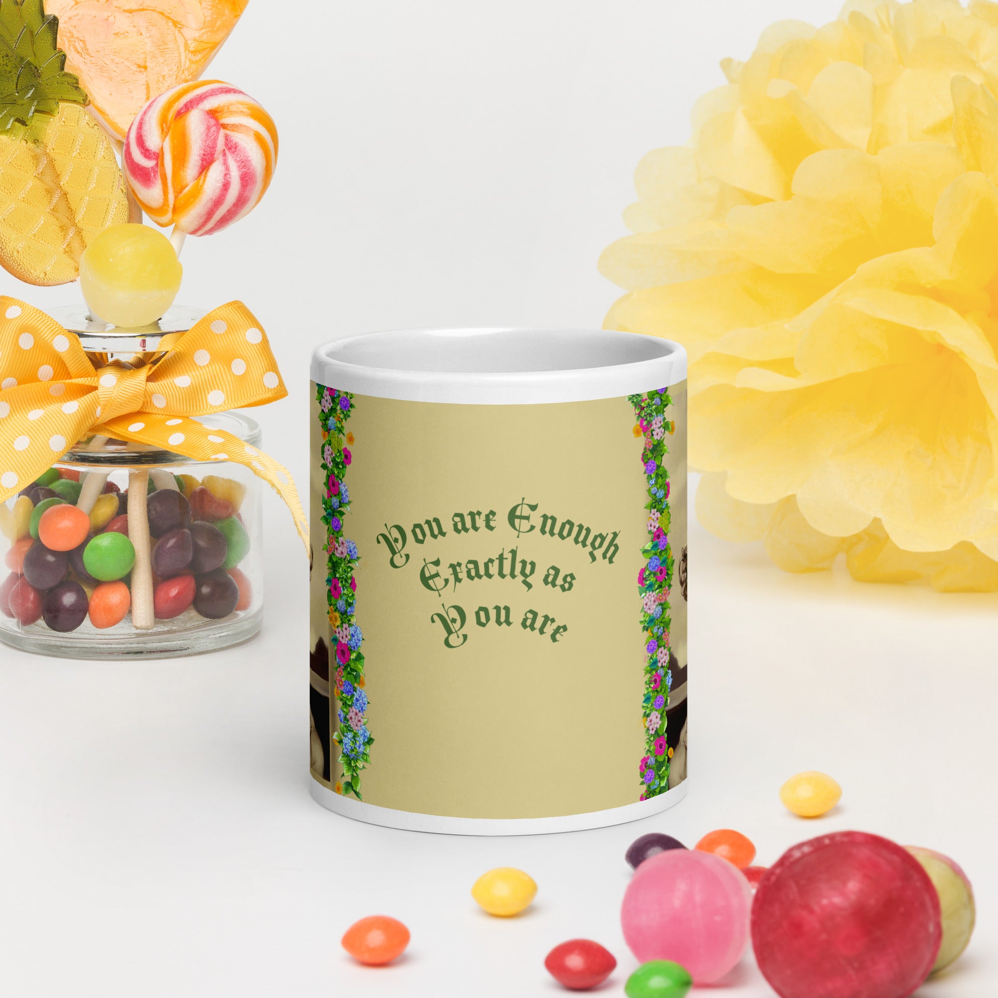 Beautiful Premium white ceramic mug features a vintage sepia-toned woman with flowing hair, holding an ornate decorative mug, framed by colorful floral garlands. With the empowering message "You are Enough Exactly as You are" -20 - oz front view