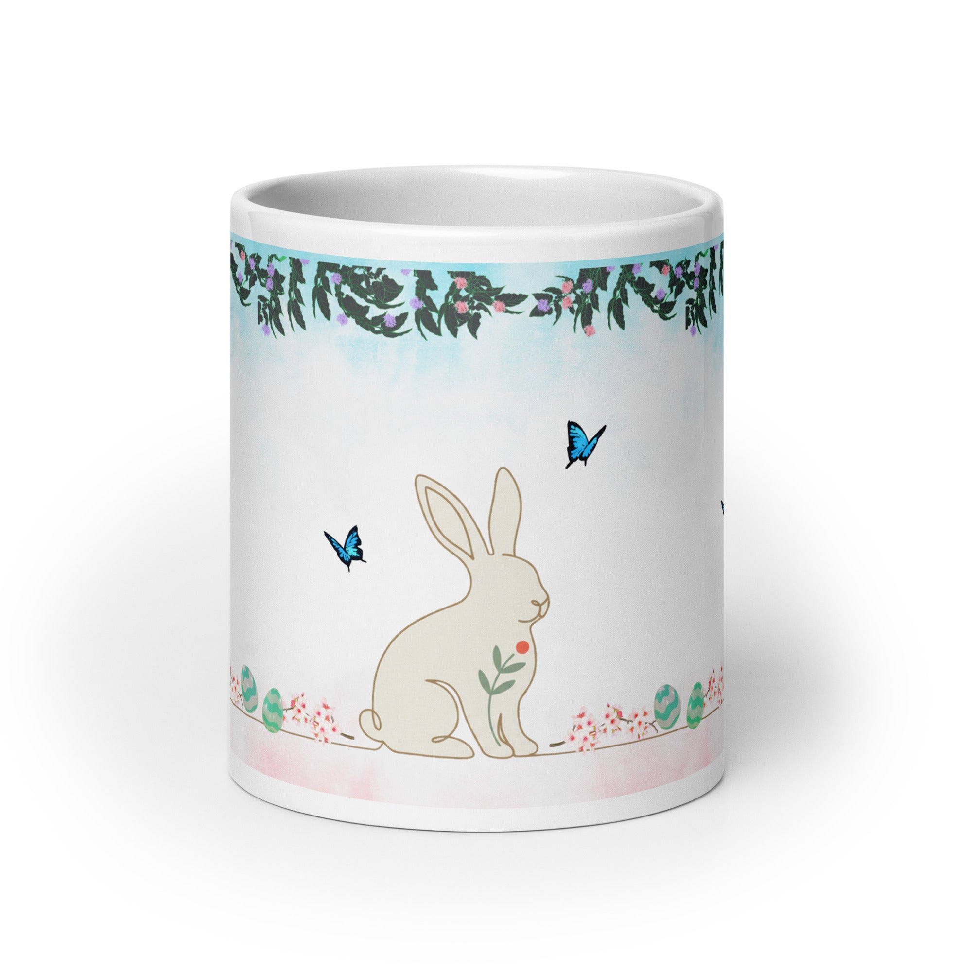 Premium White Ceramic - Bunny and Butterfly Mug -Gentle cream-colored bunny in peaceful garden setting
Blue butterflies fluttering around the scene- 20 oz front view