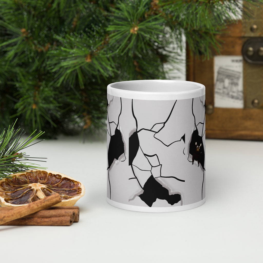 Premium white ceramic - cracked wall design- Mouseterious mug - black and white with mouse peeking through hole in wall - 20 oz front view