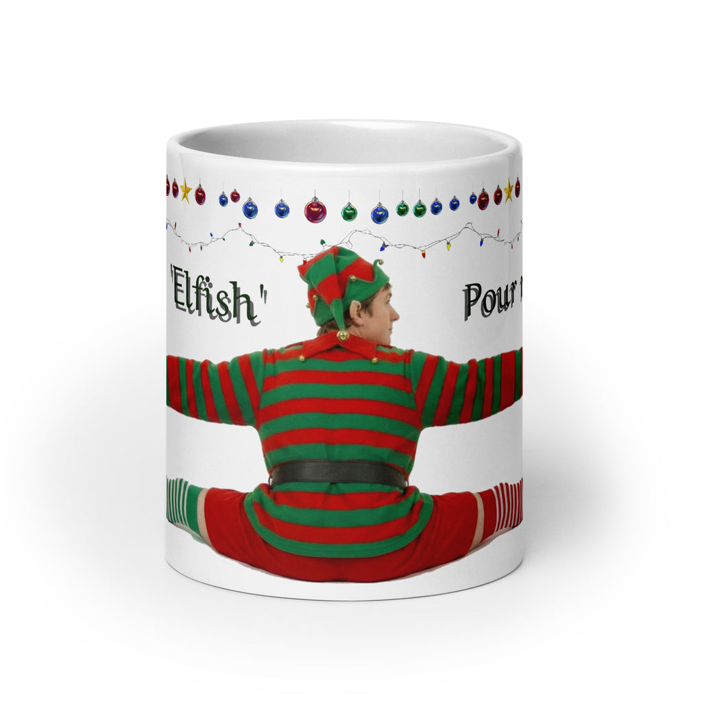 Premium white ceramic - Don't be Elfish - Pour me a cup! - Coffee mug - features cheeky elf dressed in holiday colors hugging the mug with colorful ornaments border at the top- 20 oz front view