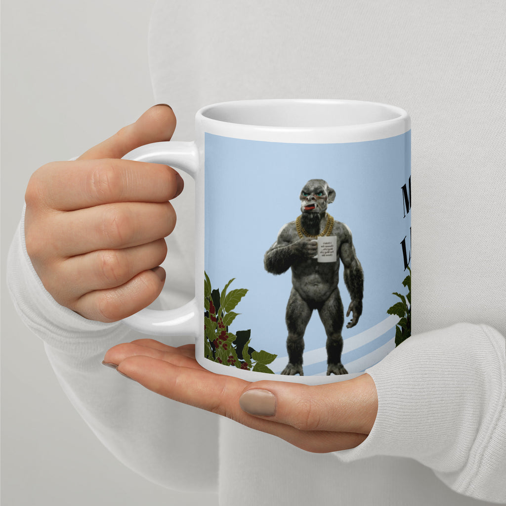 Premium white ceramic mug  features a muscular orc living his best Mug Life! With his gold chain bling, plants, and a confident stance, this green-skinned coffee lover knows what's up. The text reads "I didn't choose the Mug Life... The Mug Life Chose Me 20 oz left view