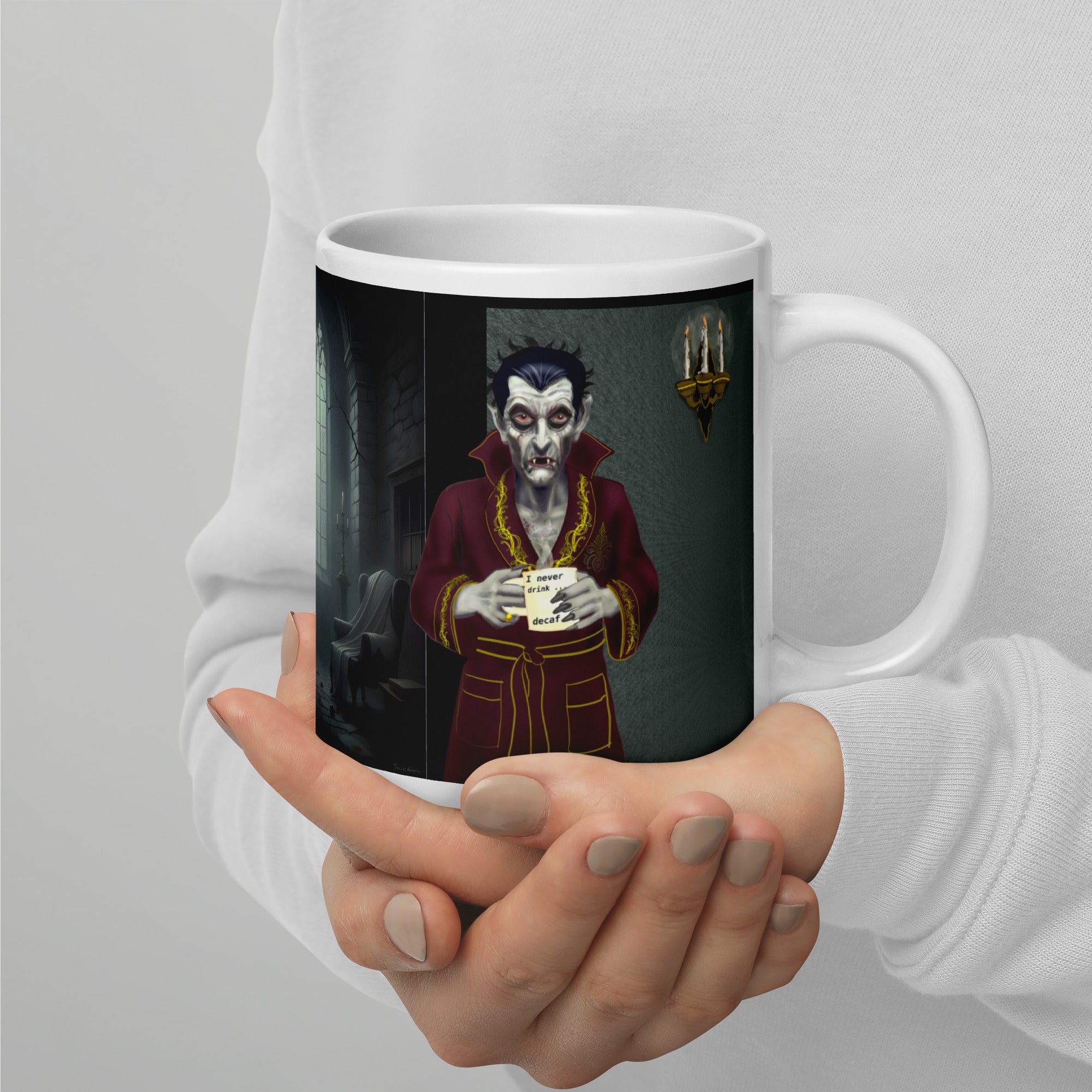 Dracula Coffee Mug - I Have Crossed Oceans of Time to Find a Barista- Premium white ceramic mug with Dracula standing in his castle wearing burgundy bathrobe with gold trim - a candelabra on the wall- he is holding a coffee mug with text " I never drink......decaf" - 20 oz right view- held in persons hand