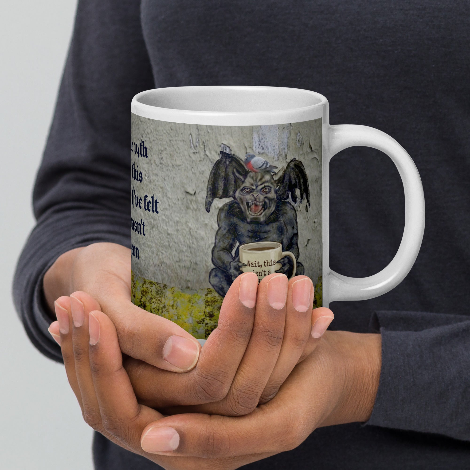 Premium white ceramic Gargoyle mug- Grumpy gargoyle sitting on ledge with a pigeon on his head holding a coffee mug with "Wait, this isn't a bird bath?"written on it. 20 oz right view